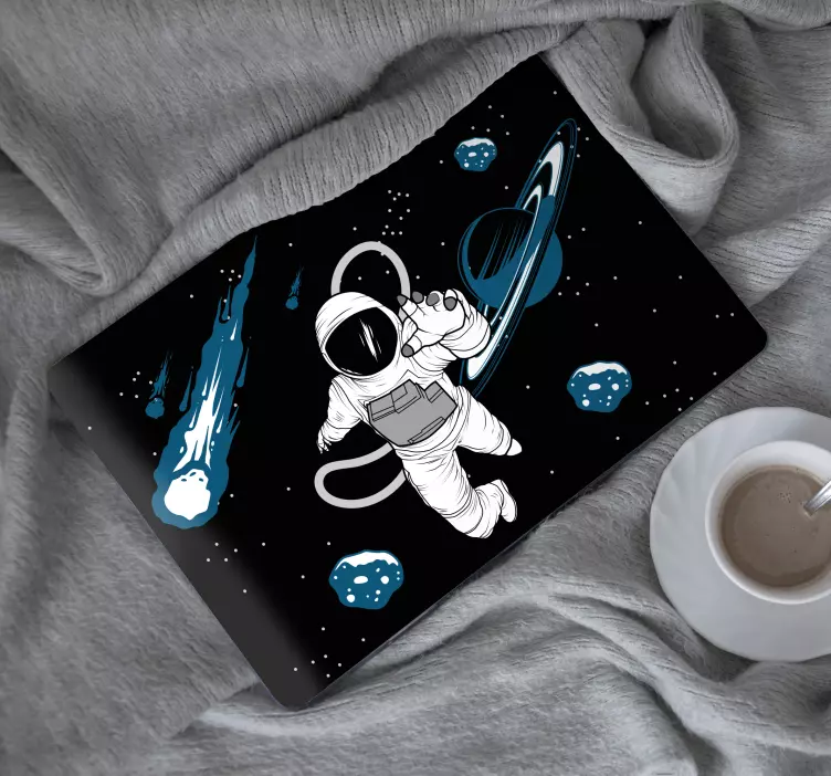 Pegatina para portátil astronauta flotando en el cosmos - TenVinilo
