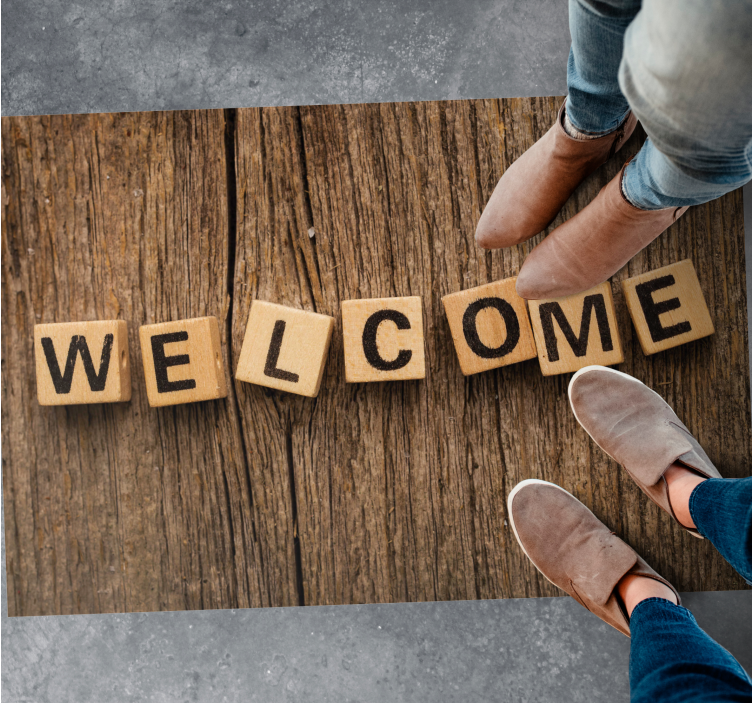 Alfombra vinílica frase alfabeto de madera de bienvenida - TenVinilo