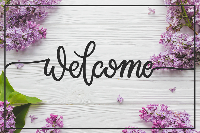 Alfombra vinílica frase entrada floral de bienvenida - TenVinilo